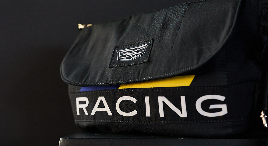 Custom handbag crafted from authentic Cadillac Racing fire suits.